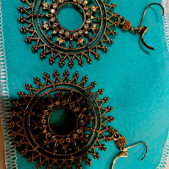 Beautiful gently worn fashionable golden color  earrings with crystals.Must have